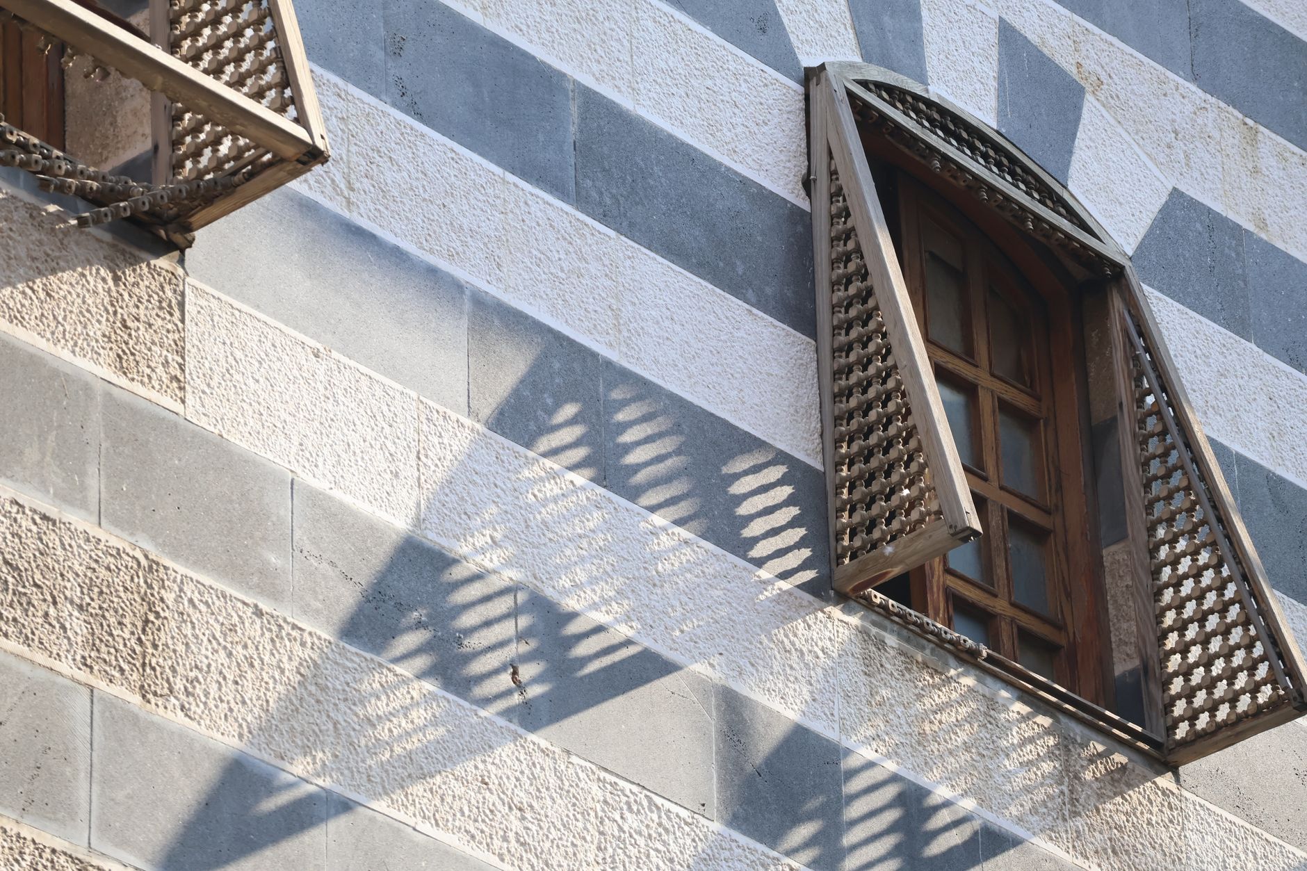 Geometric lattice screen on a modern building facade