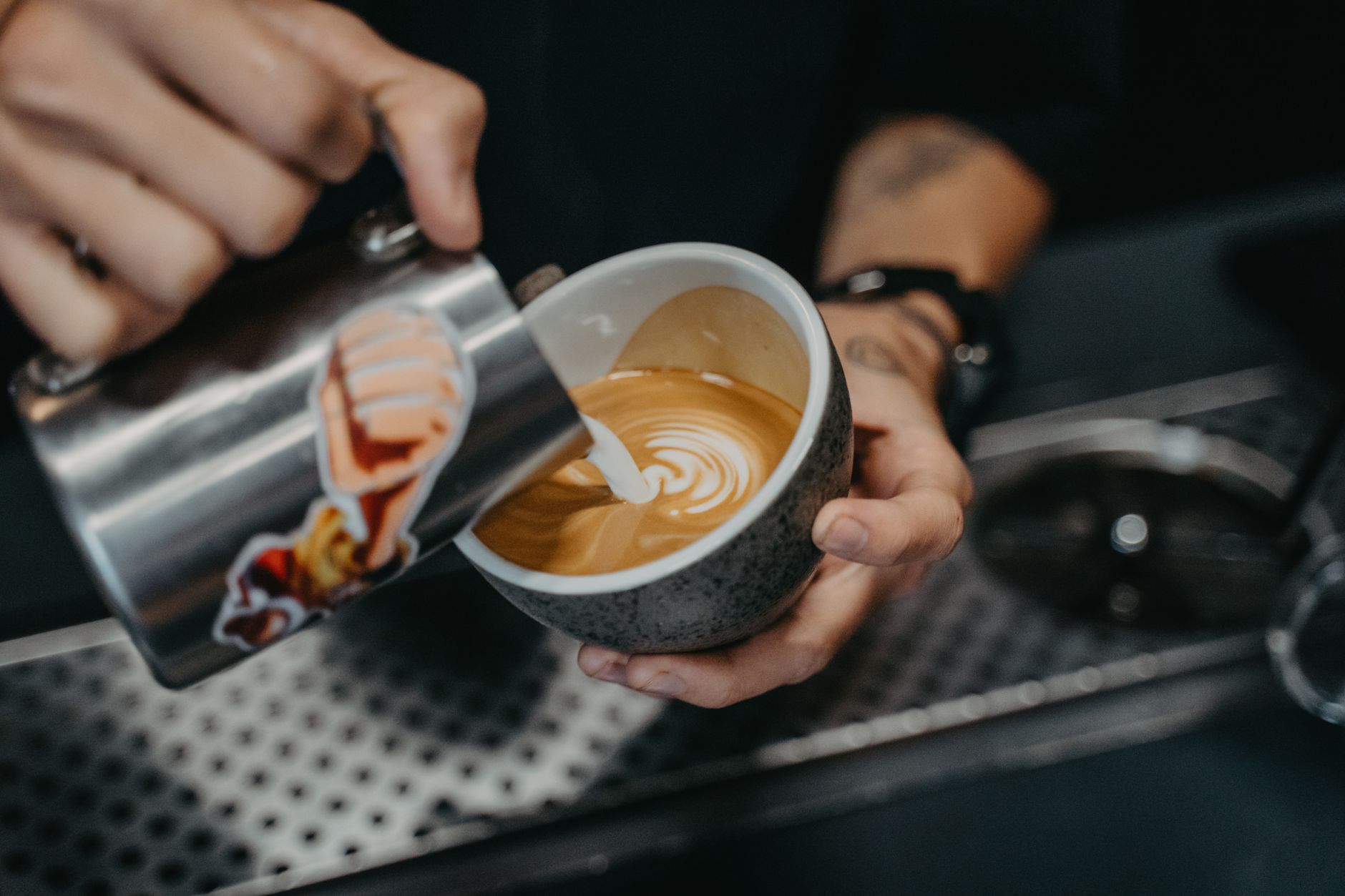Barista preparing a coffee at the counter