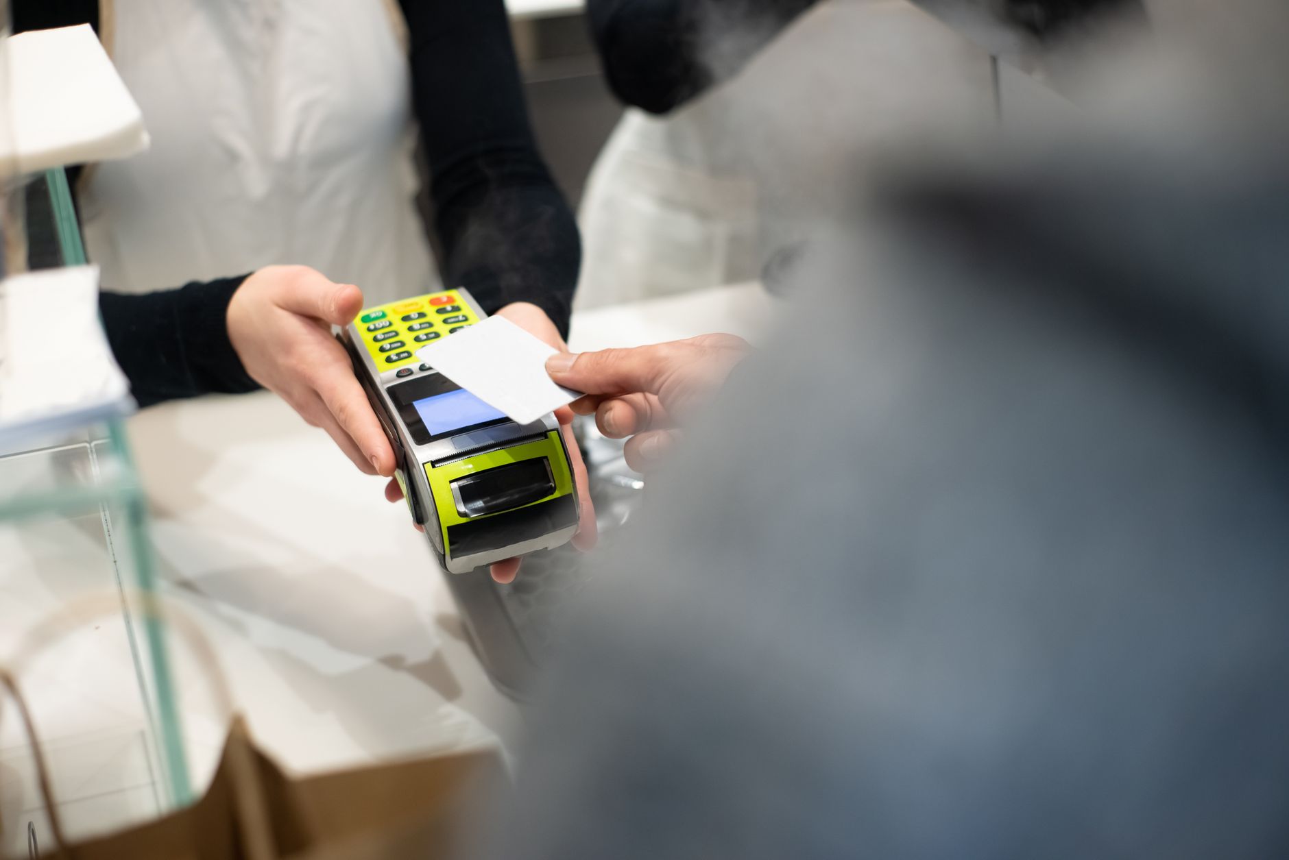 Paying by card at a shop counter