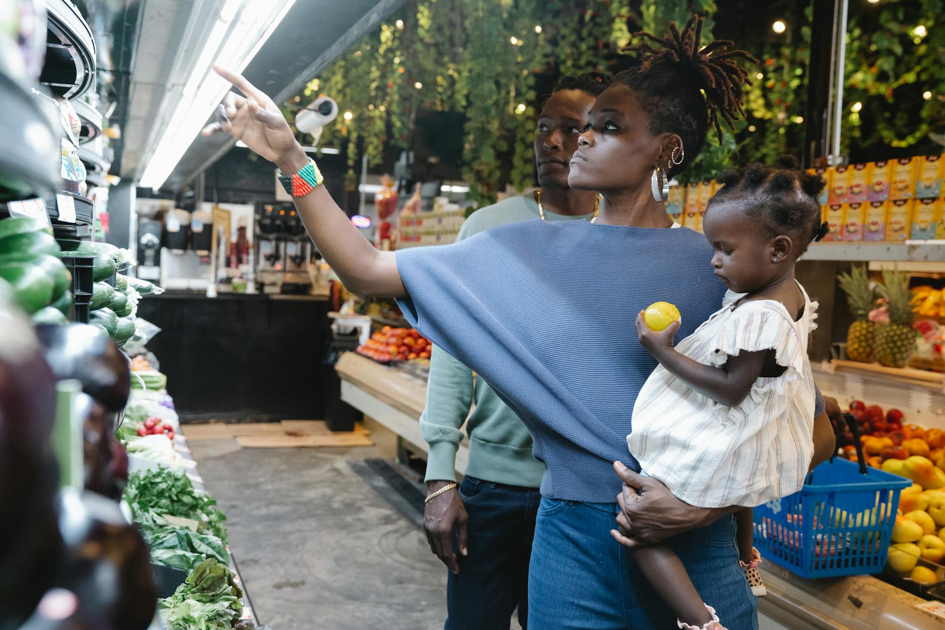 Family doing a weekly fresh-produce shop in a supermarket