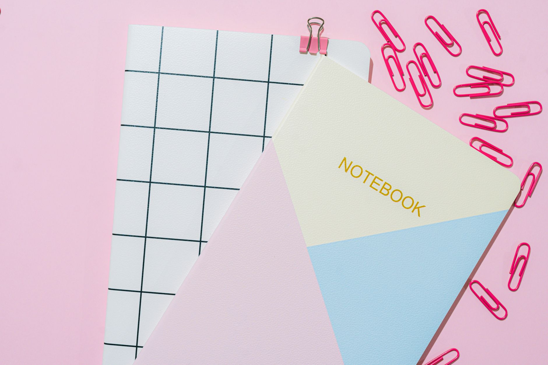 School notebooks and stationery laid out on a desk