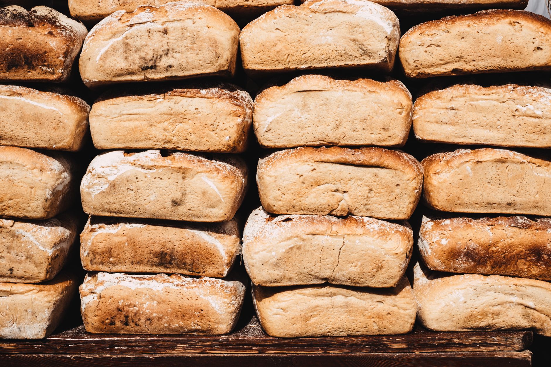 Fresh bread loaves on a wooden board