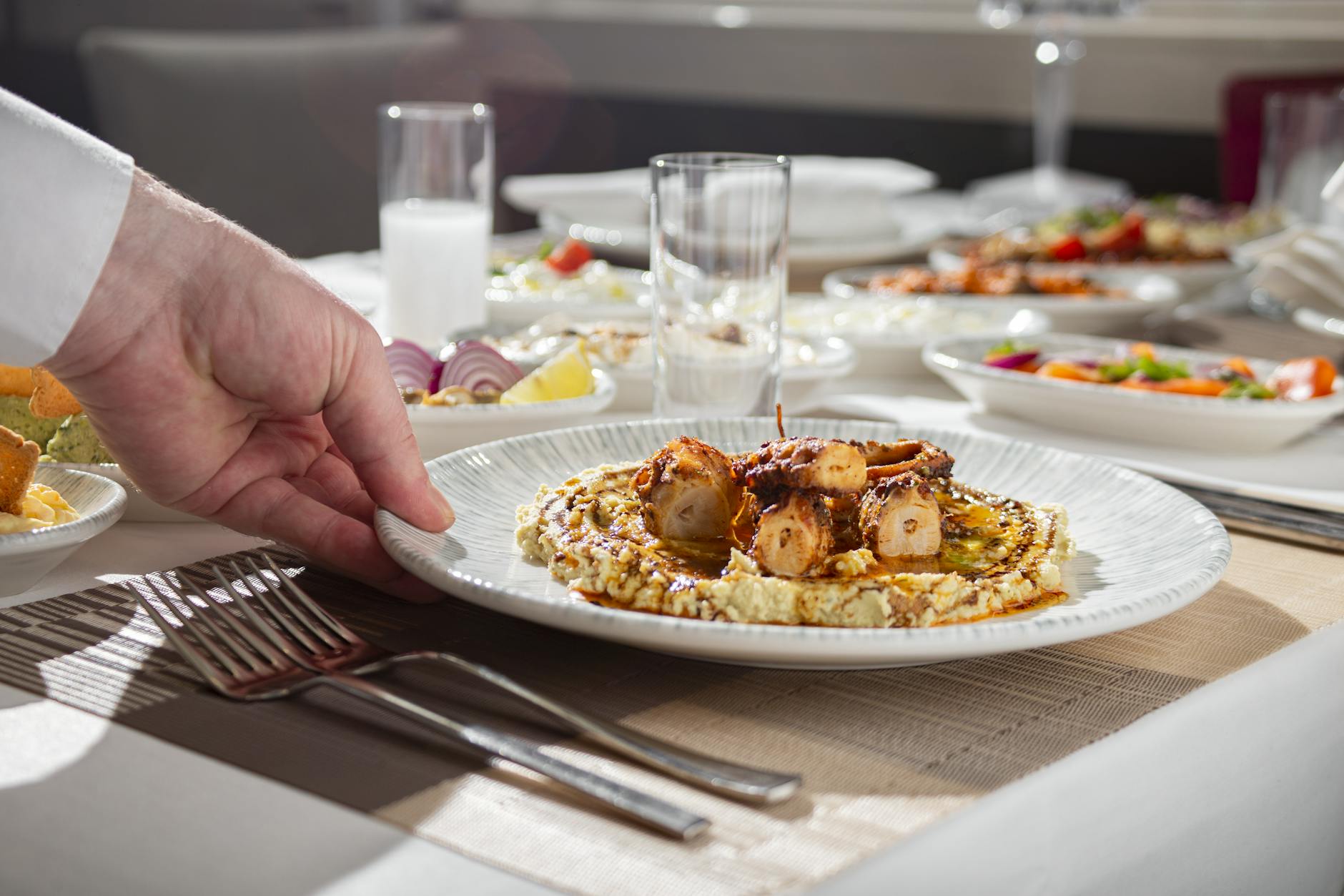 Plated fine-dining tasting menu at a chef's table