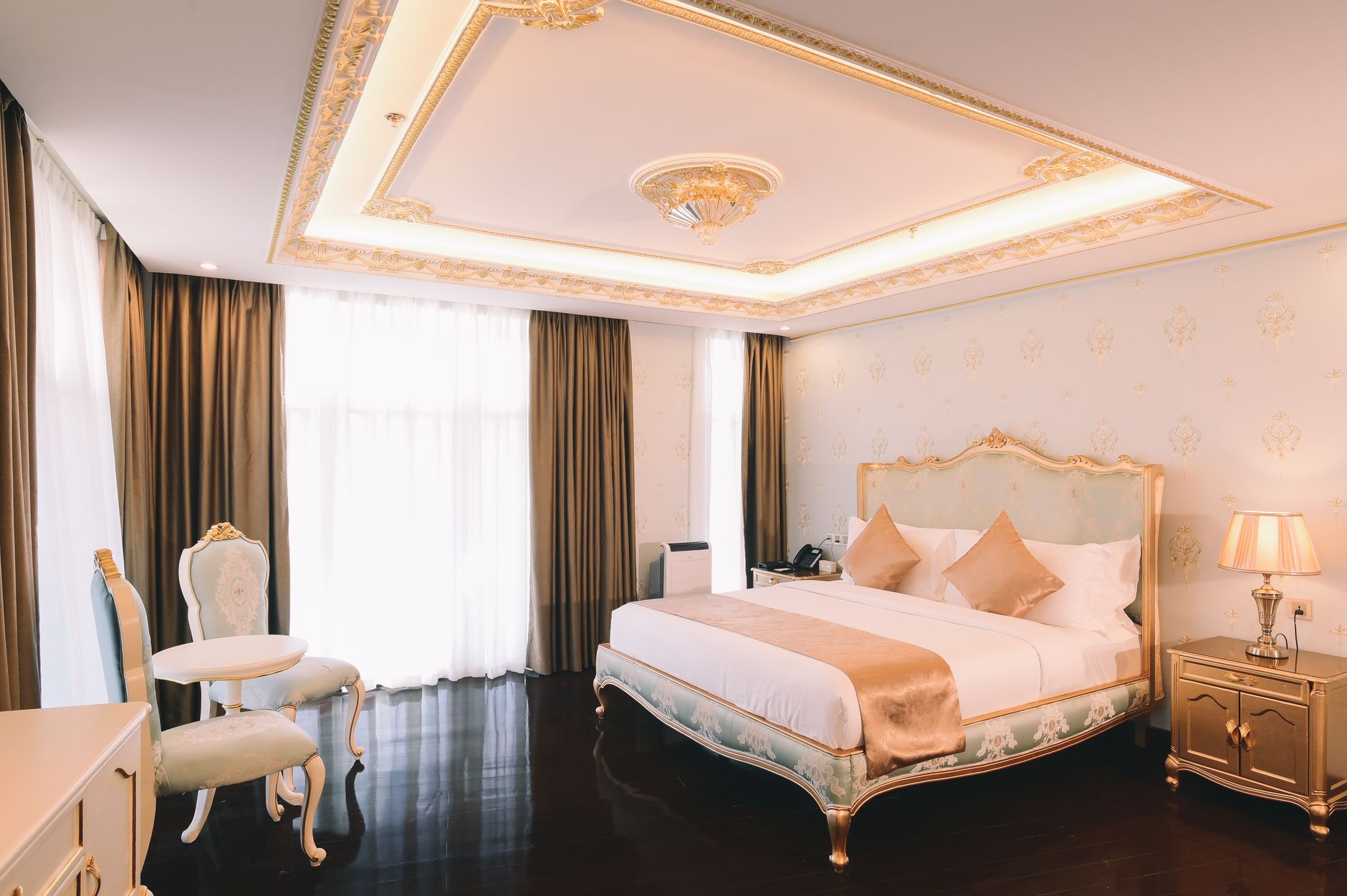 Boutique hotel king bedroom with a city view