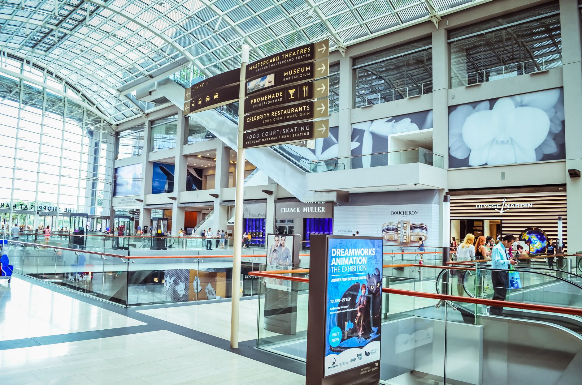 Atrium of a Dubai shopping mall with luxury-brand shoppers