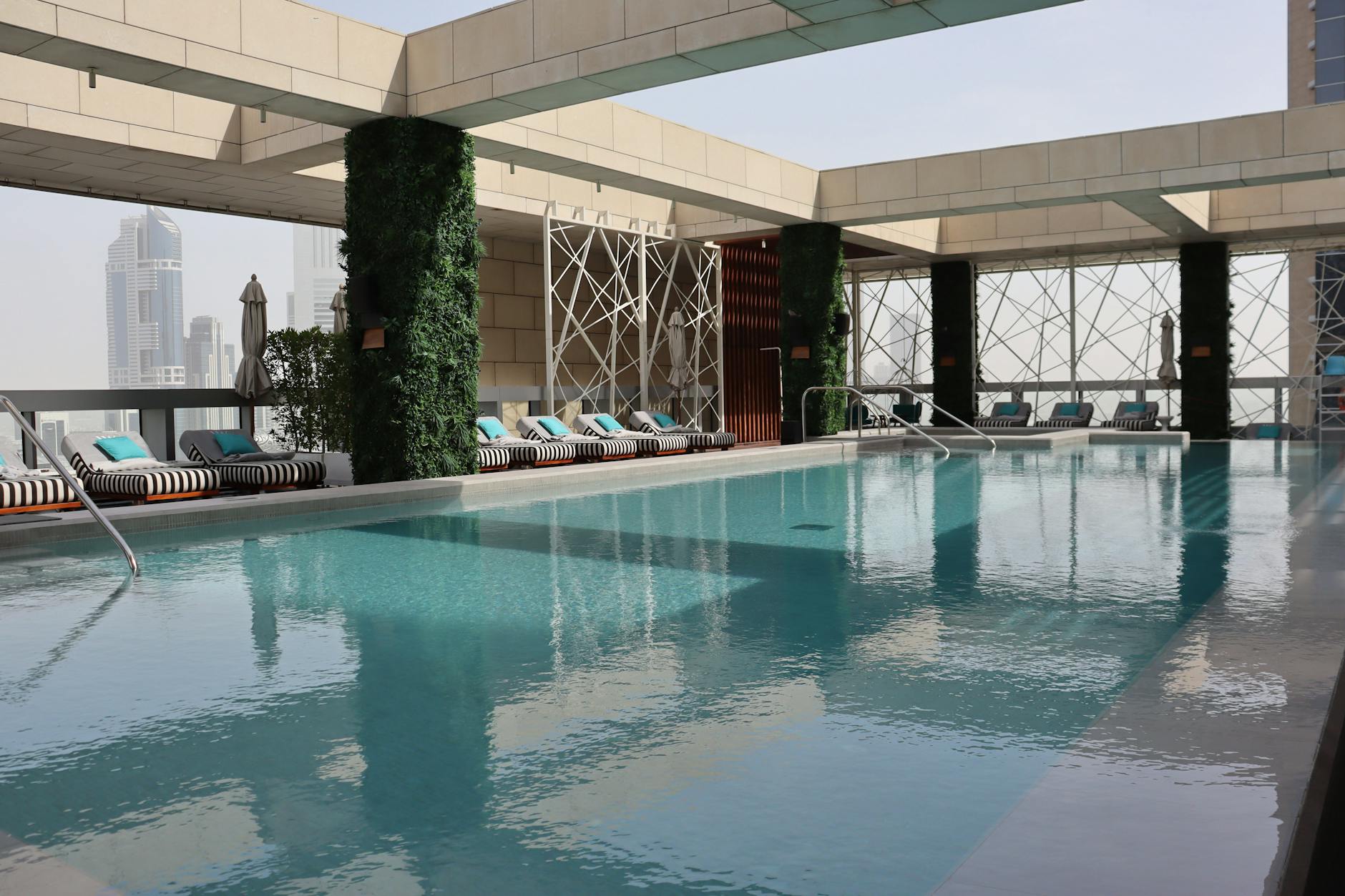 Address Downtown Dubai-style hotel pool deck at dusk