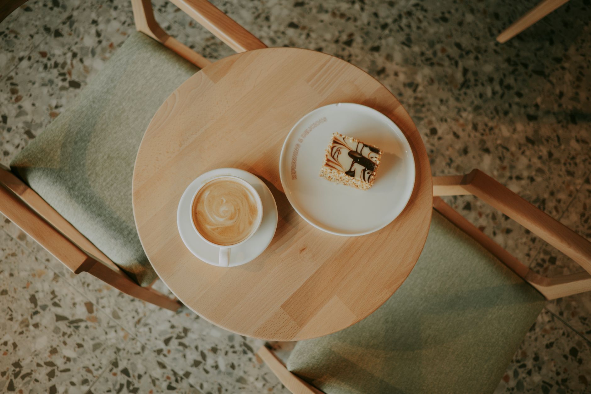 Coffee and pastry on a café table