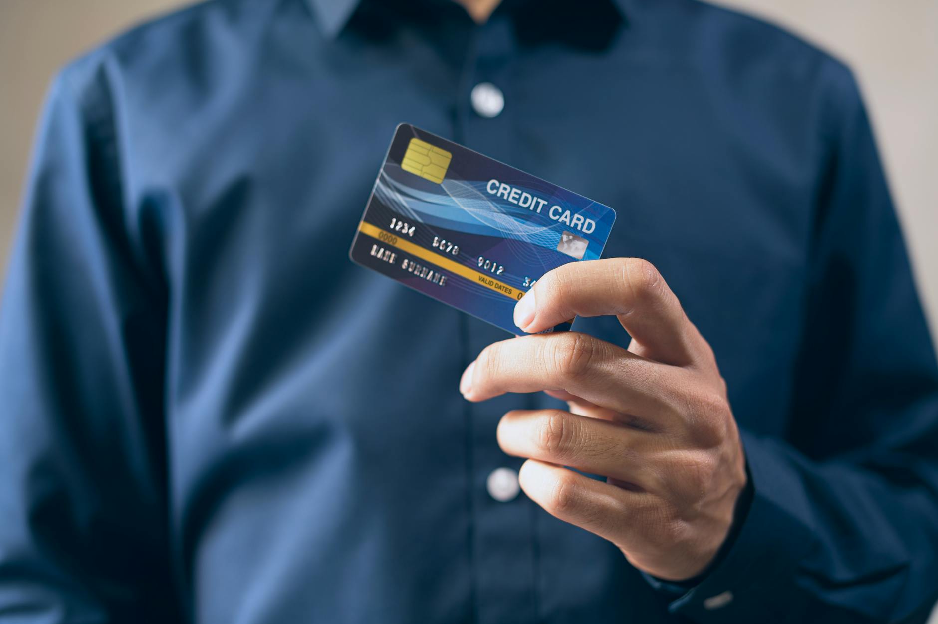 Hand holding a credit card