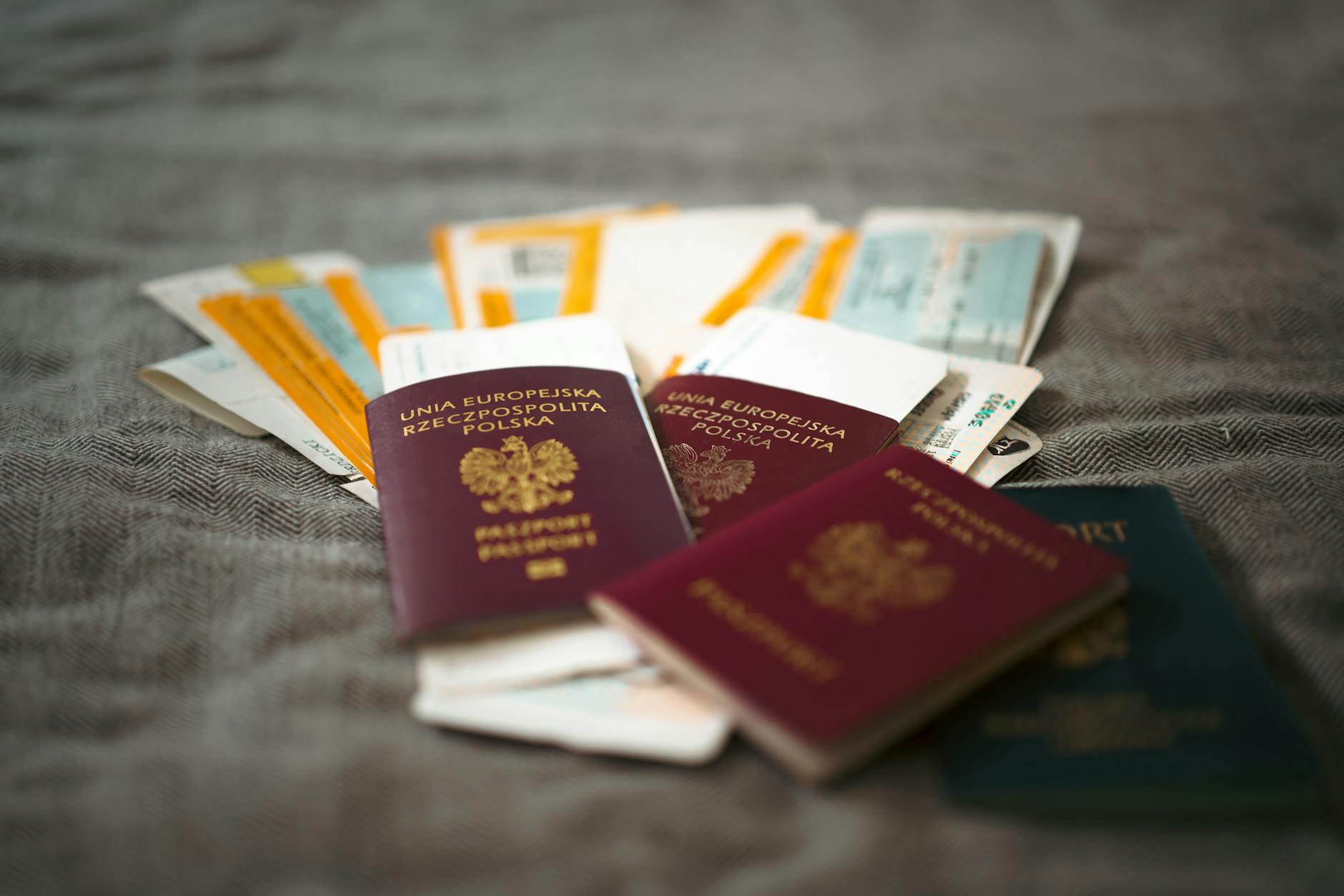 Passport and boarding pass on a wooden table