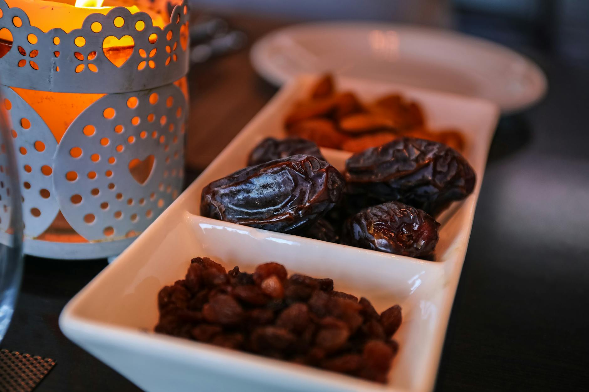 Iftar table set with dates and lanterns