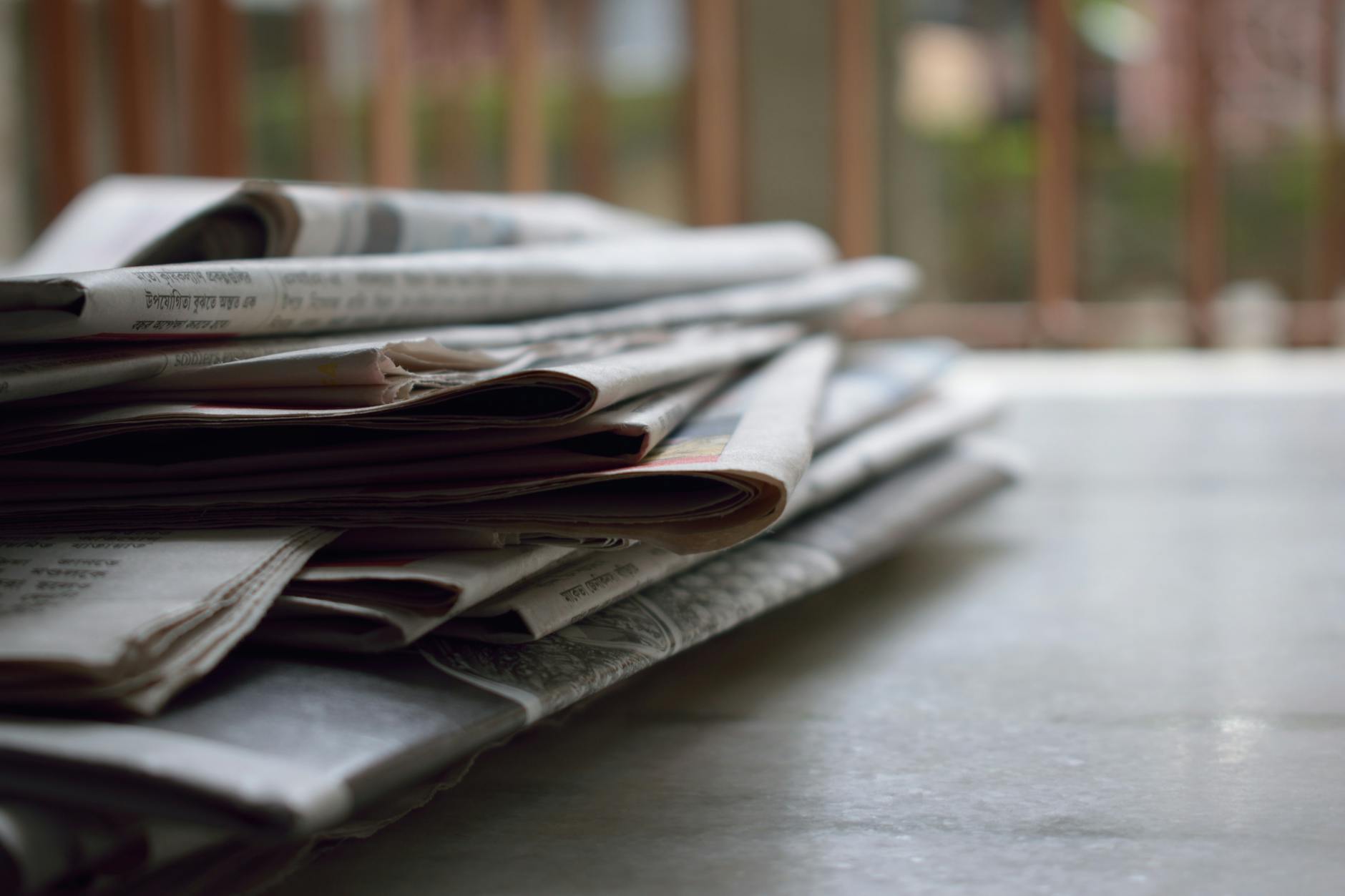 Editorial desk with newspaper and notebook