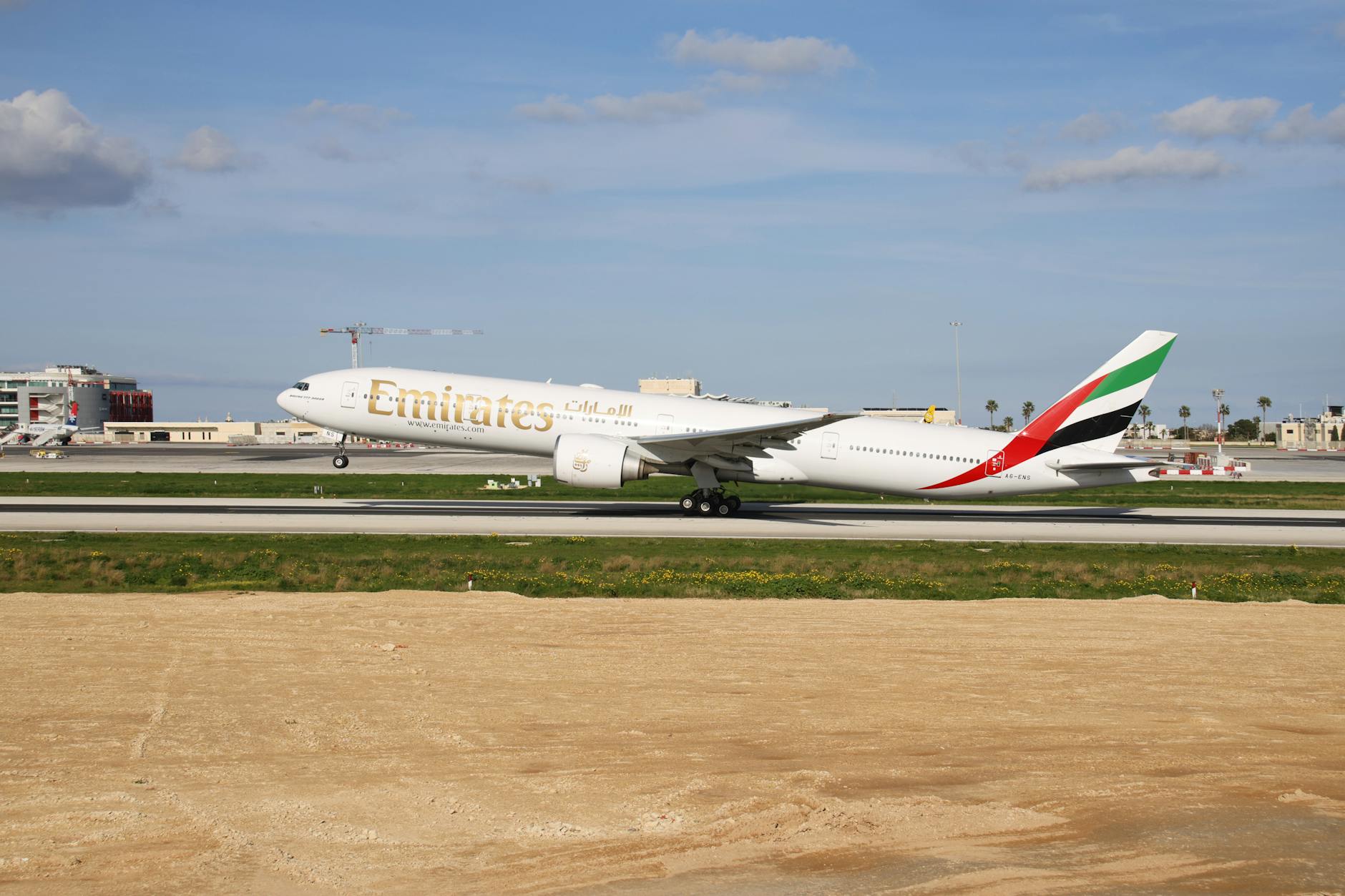 Emirates wide-body aircraft at the gate
